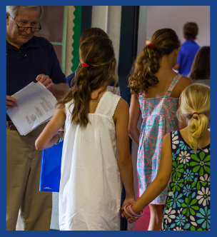 Students holding hands as they walk together